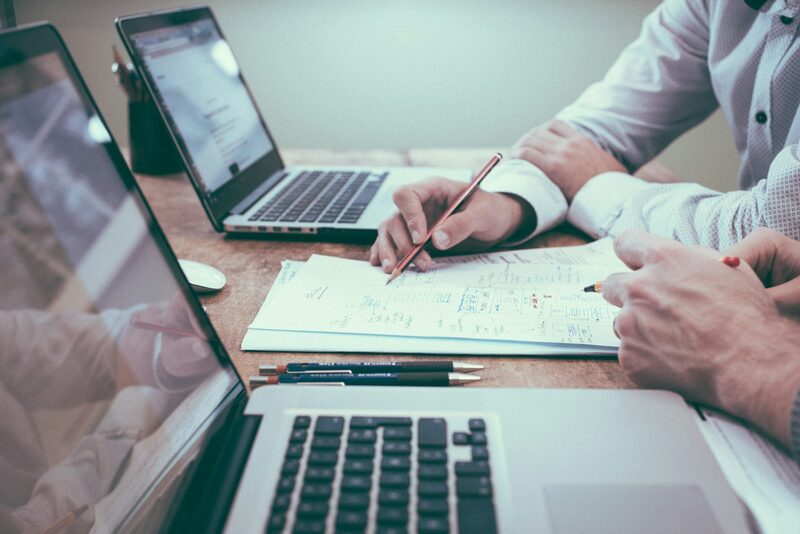 Medical billing specialists reviewing claims and coding documentation for a US clinic